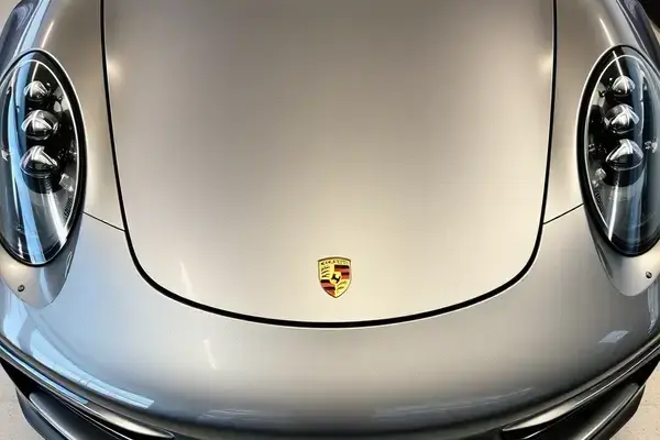 Sports car with swirl marks, scratches and oxidized paint surface