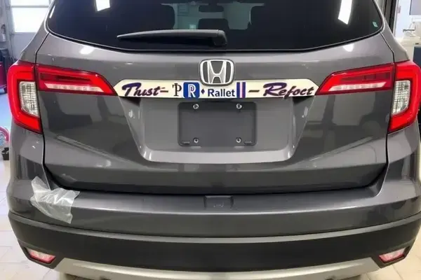 Professional SUV repair with perfect paint match and restored bumper